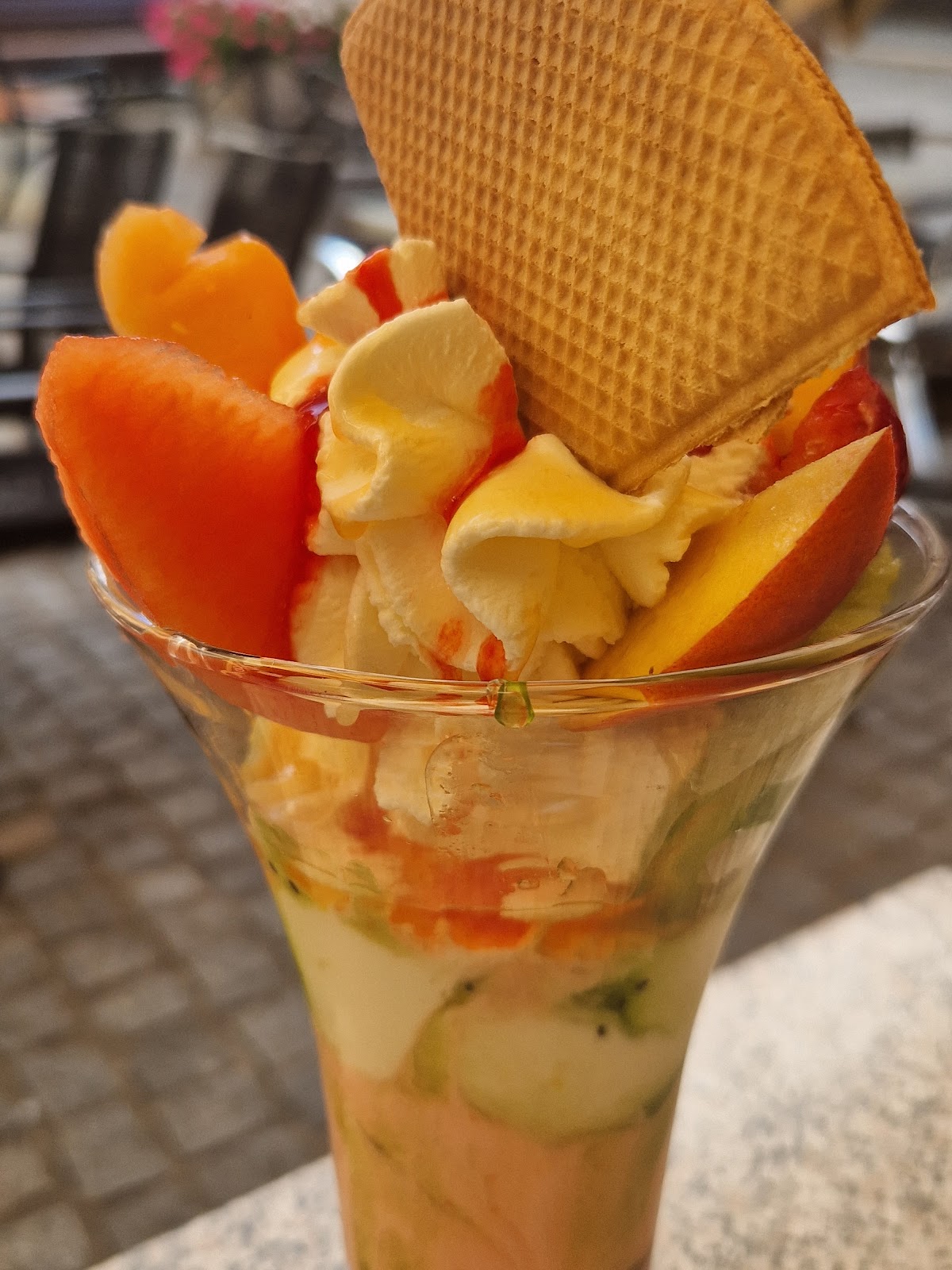 Ice cream sundae with wafer and fresh fruit