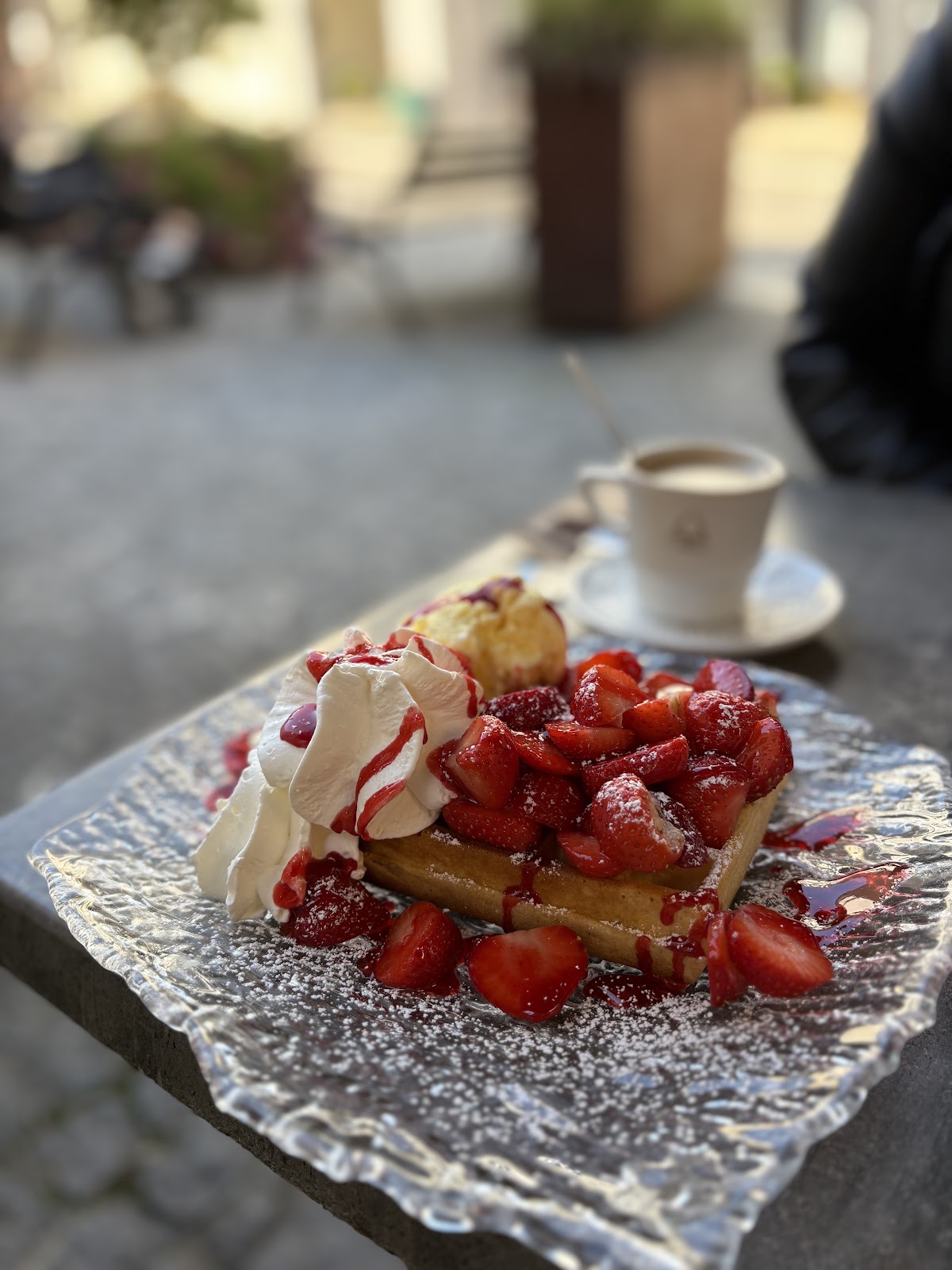 Belgian waffle with strawberries and cream